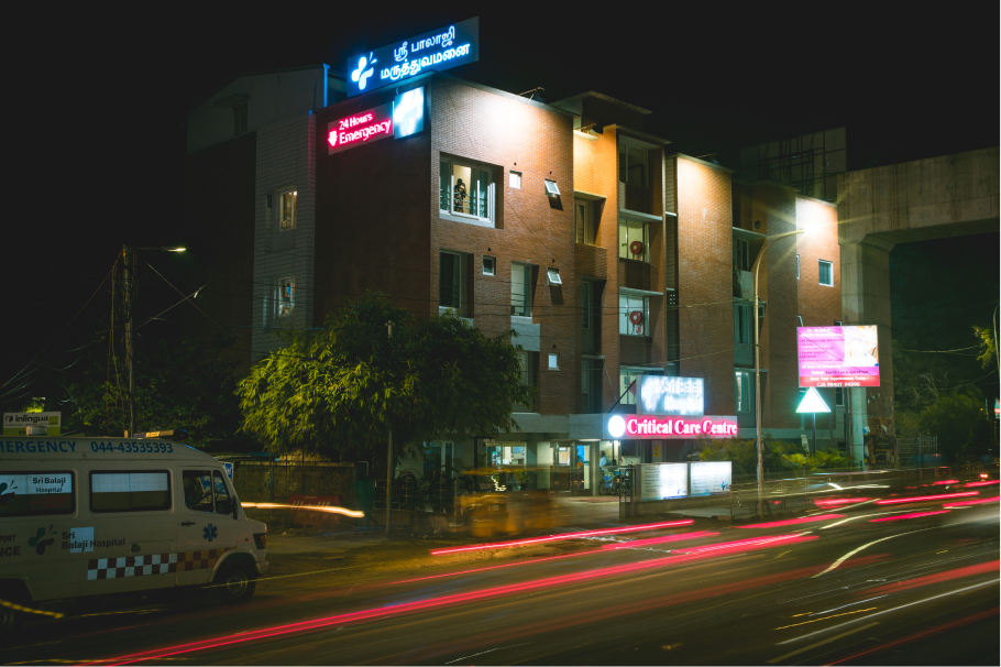 The complete front view of the hospital at night.