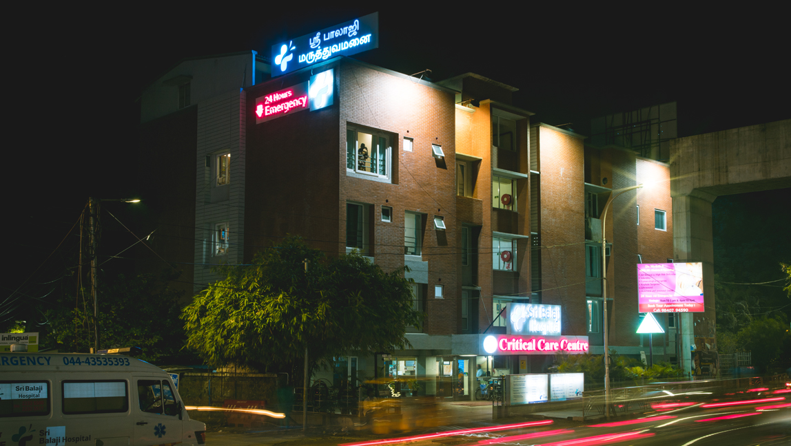 The front view of Sri Balaji Hospital during daytime.